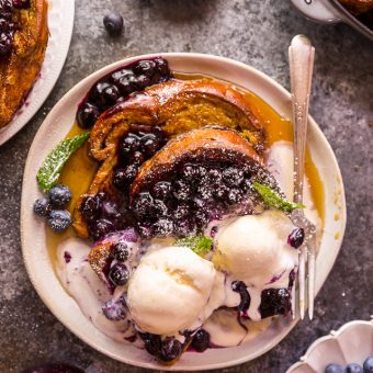 Buttery slices of brioche bread and fresh blueberry maple syrup make this recipe a total showstopper! While it's a little more work than most breakfast casseroles, it's totally worth it! This Brioche French Toast with Blueberry Compote is a great recipe for a lazy Saturday, Christmas morning, or anytime you want to make breakfast extra special! #frenchtoast #blueberrycompote #brioche #briochefrenchtoast #breakfast