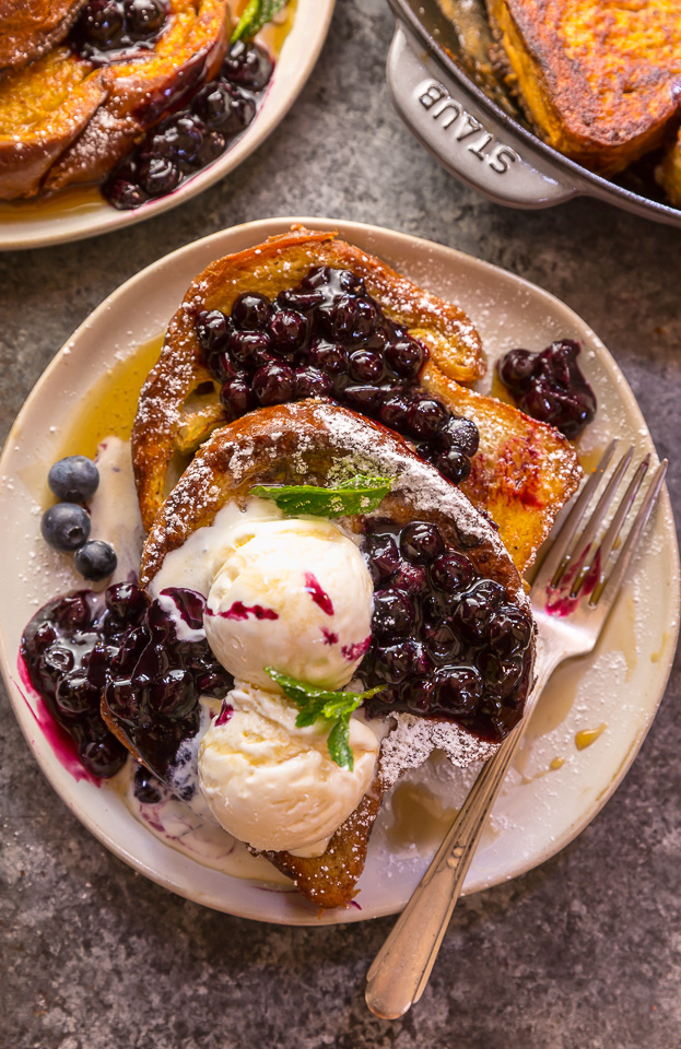 Buttery slices of brioche bread and fresh blueberry maple syrup make this recipe a total showstopper! While it's a little more work than most breakfast casseroles, it's totally worth it! This Brioche French Toast with Blueberry Compote is a great recipe for a lazy Saturday, Christmas morning, or anytime you want to make breakfast extra special! #frenchtoast #blueberrycompote #brioche #briochefrenchtoast #breakfast