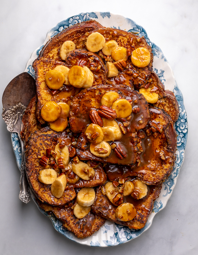 This Easy Bananas Foster French Toast is one of our favorite breakfast recipes! Crispy slices of buttery brioche are topped with a delicious homemade bananas foster sauce made from dark rum, butter, brown sugar, heavy cream, and crunchy pecans. Delicious on it's on, but devilishly good with whipped cream or vanilla ice cream!