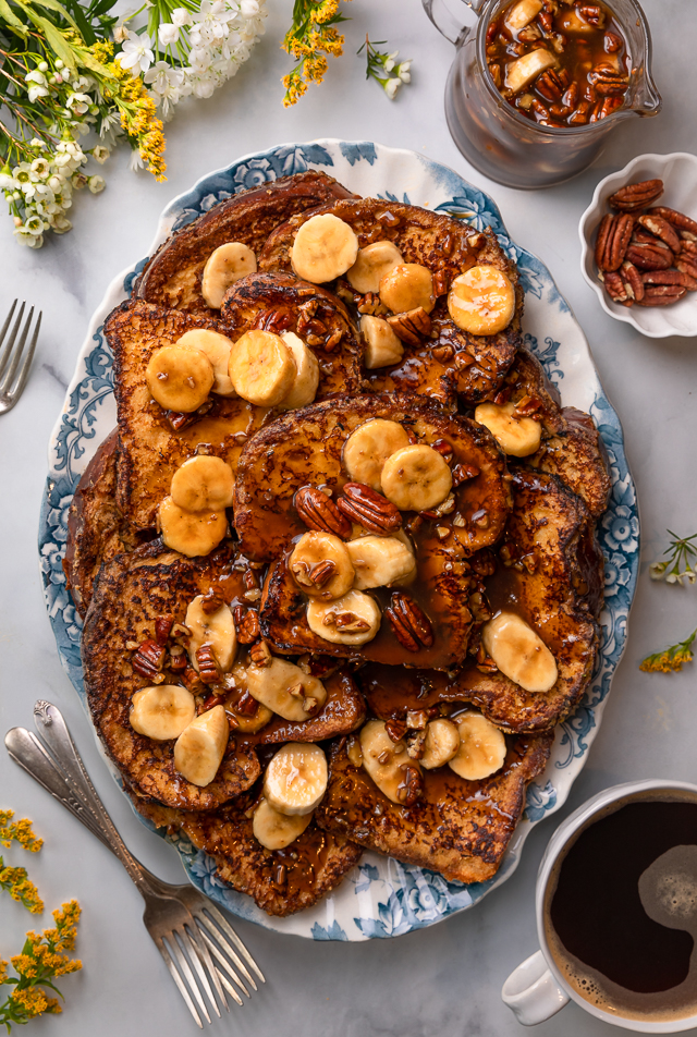 This Easy Bananas Foster French Toast is one of our favorite breakfast recipes! Crispy slices of buttery brioche are topped with a delicious homemade bananas foster sauce made from dark rum, butter, brown sugar, heavy cream, and crunchy pecans. Delicious on it's on, but devilishly good with whipped cream or vanilla ice cream!